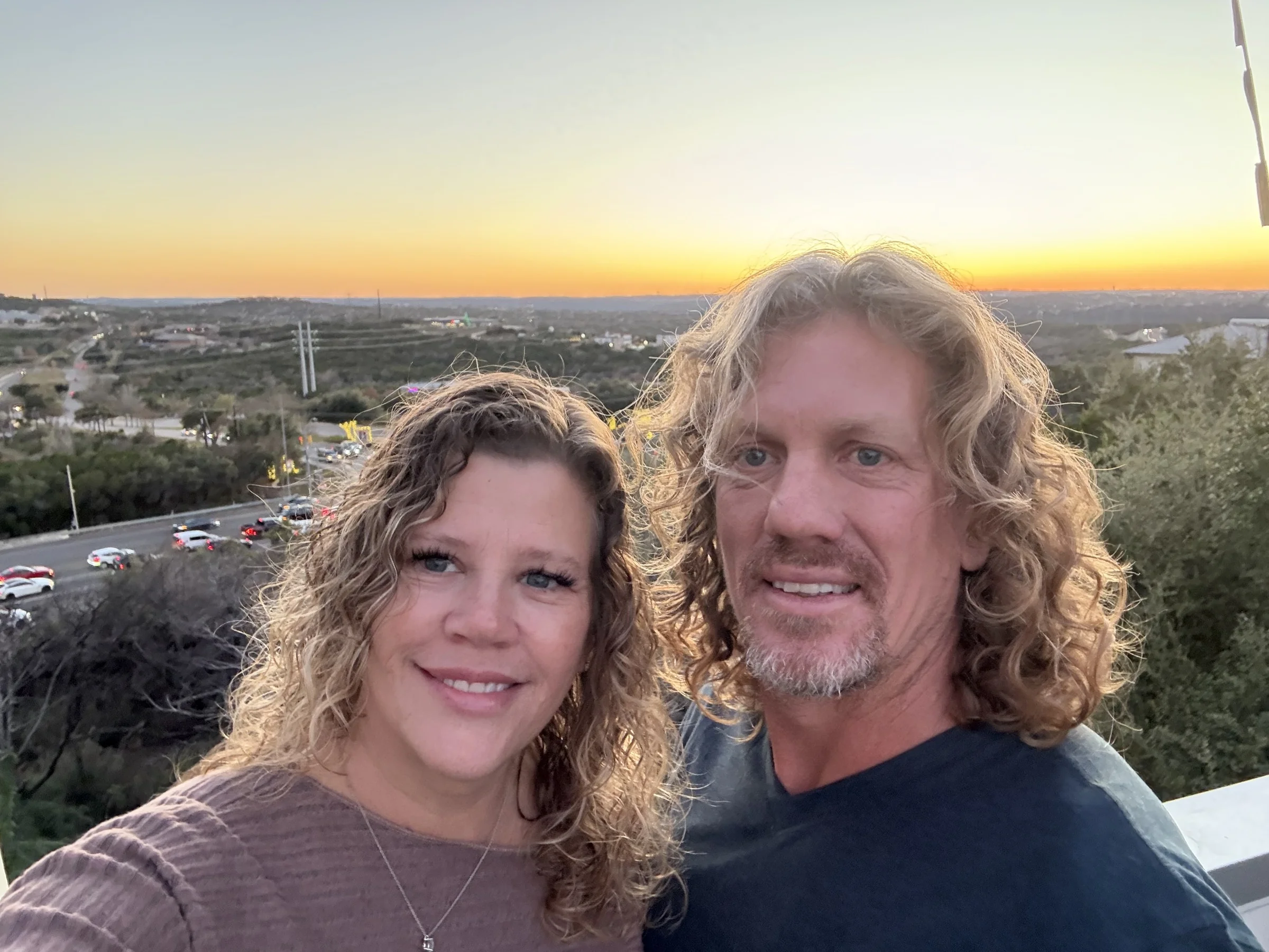 Ammon and Crystal Covino at sunset overlooking the valley